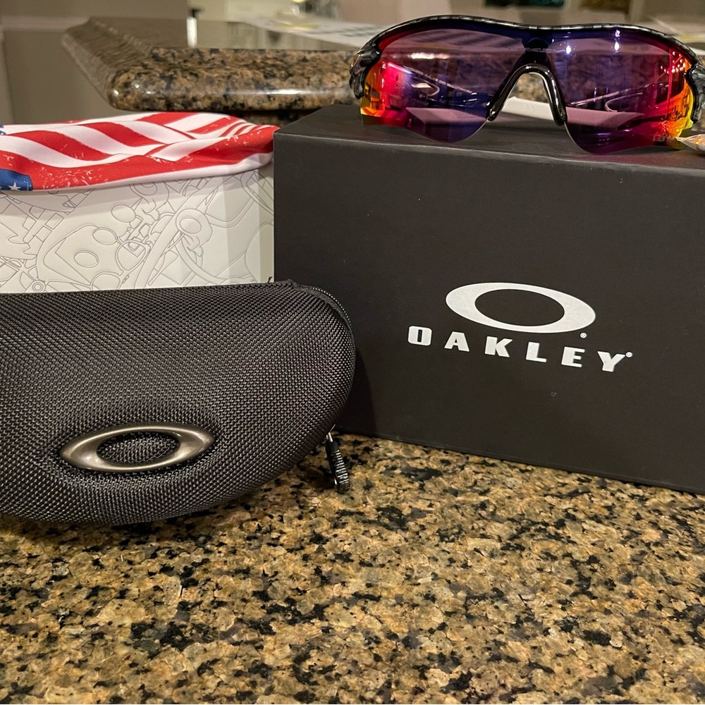 Gray oakleys with red/orange lenses size 51